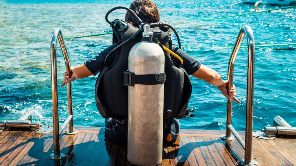 Scuba diver getting ready to jump in the water.